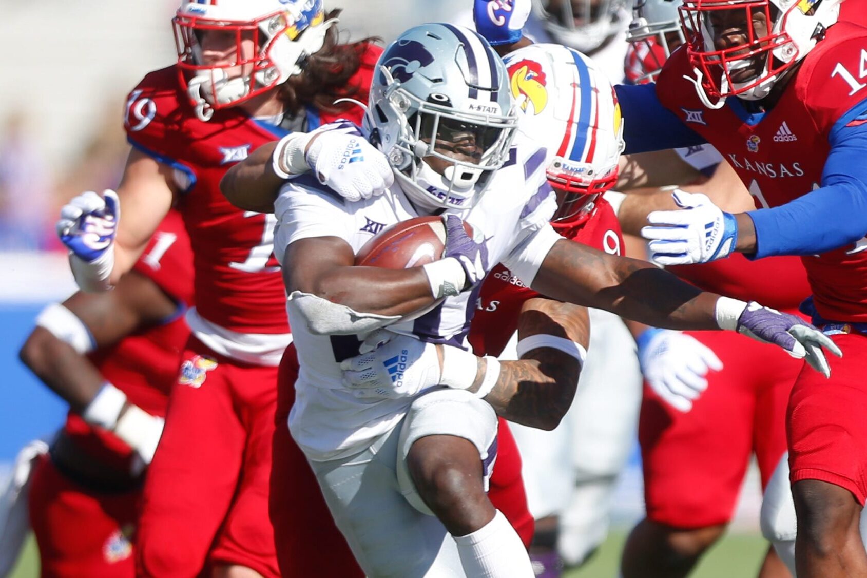 Kansas State sophomore running back Joe Ervin (20) makes it through the Kansas defense in the second quarter of Saturday's Sunflower Showdown at David Booth Kansas Memorial Field.