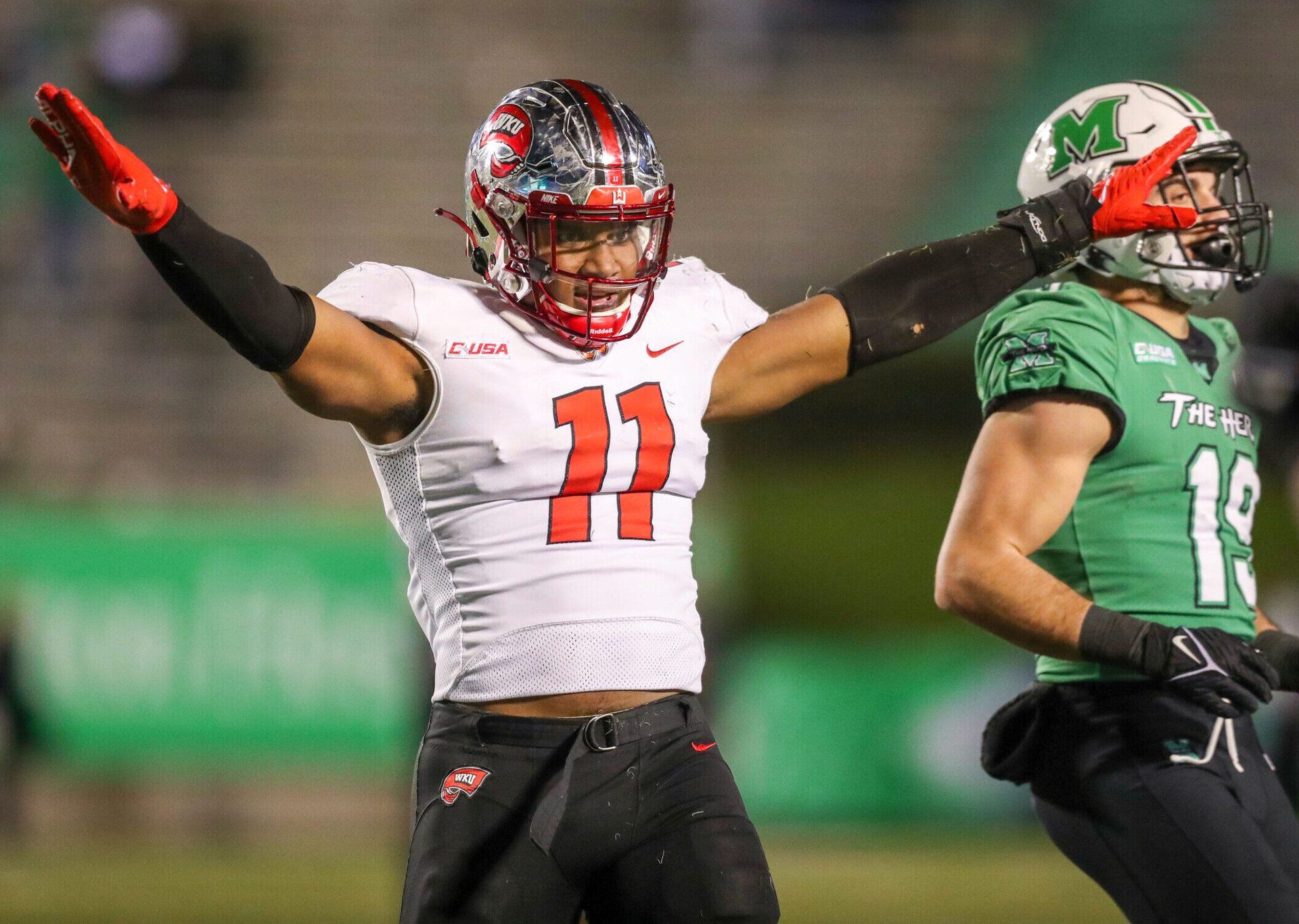 Western Kentucky Hilltoppers defensive end Jaden Hunter celebrates after a defensive play against the Marshall Thundering Herd