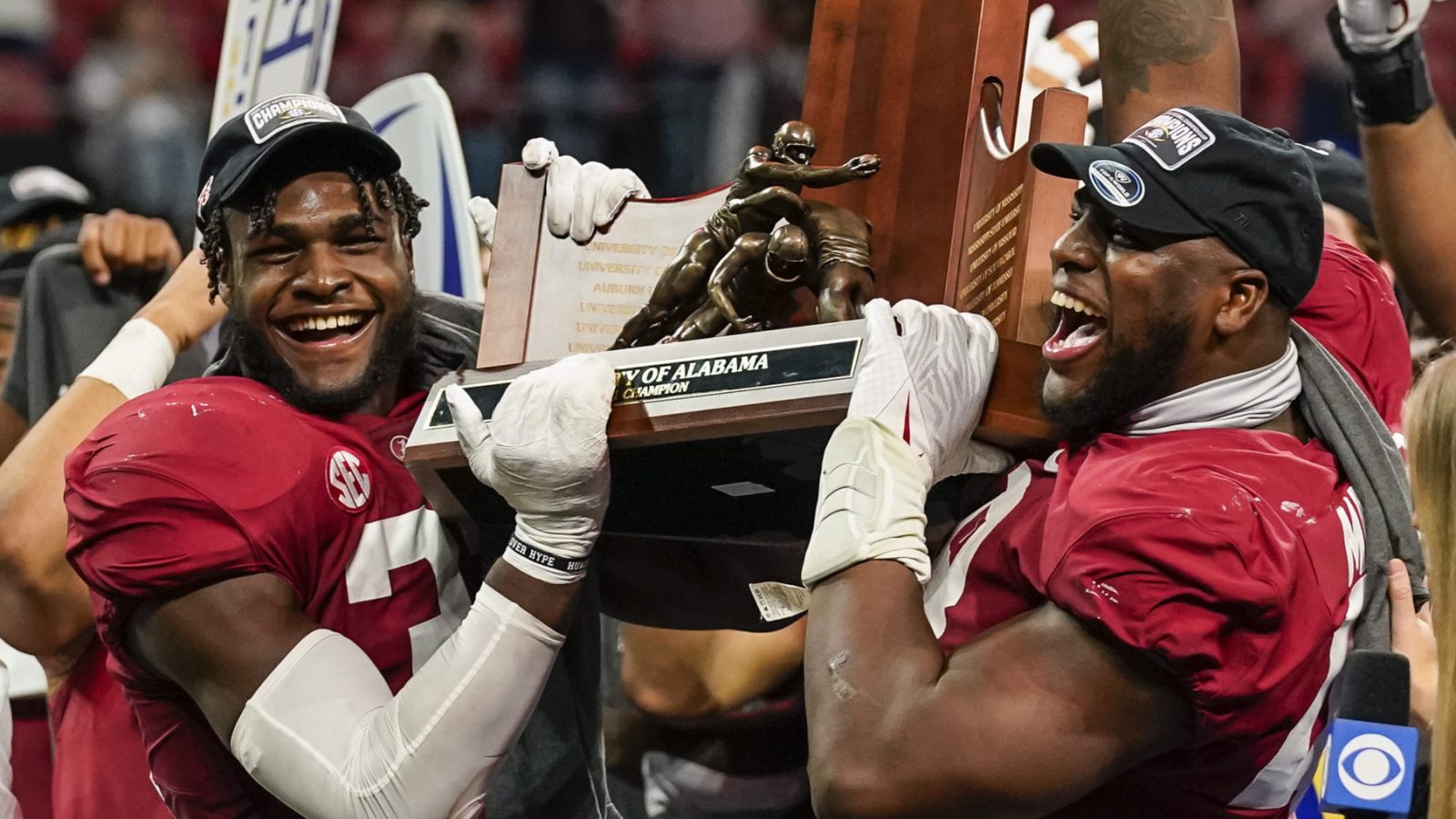 Dec 4, 2021; Atlanta, GA, USA; Alabama Crimson Tide linebacker Will Anderson Jr. (31) and defensive lineman Phidarian Mathis (48) lift the trophy for winning the SEC Championship by defeating the Georgia Bulldogs at Mercedes-Benz Stadium.