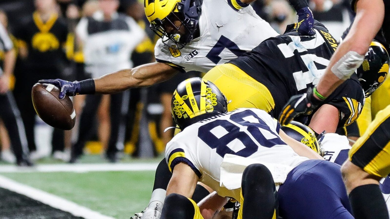 Michigan running back Donovan Edwards scores a touchdown against Iowa during the second half of the 42-3 win over Iowa in the Big Ten championship game on Saturday, Dec. 4, 2021, in Indianapolis.