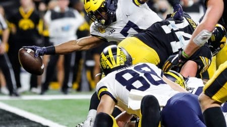Michigan running back Donovan Edwards scores a touchdown against Iowa during the second half of the 42-3 win over Iowa in the Big Ten championship game on Saturday, Dec. 4, 2021, in Indianapolis.