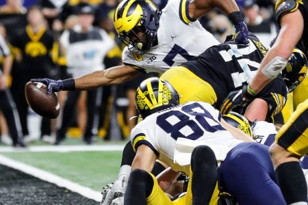 Michigan running back Donovan Edwards scores a touchdown against Iowa during the second half of the 42-3 win over Iowa in the Big Ten championship game on Saturday, Dec. 4, 2021, in Indianapolis.