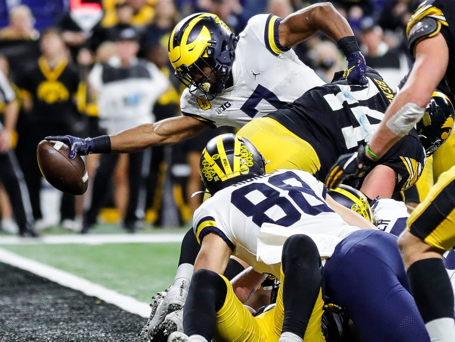 Michigan running back Donovan Edwards scores a touchdown against Iowa during the second half of the 42-3 win over Iowa in the Big Ten championship game on Saturday, Dec. 4, 2021, in Indianapolis.