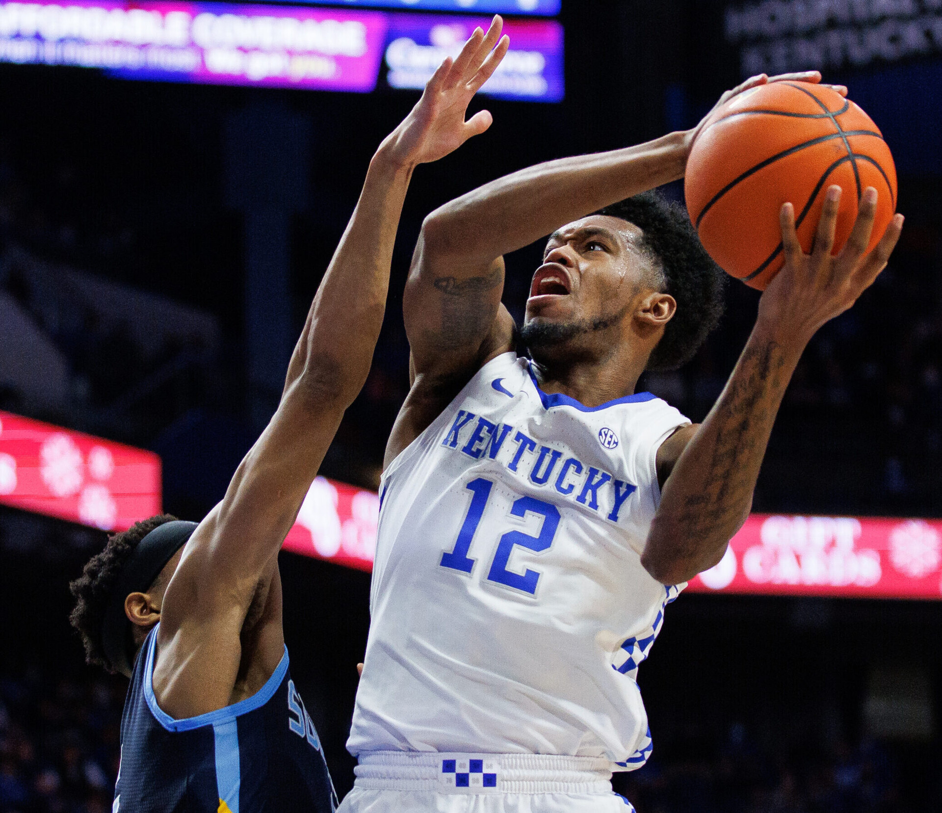 Kentucky Wildcats forward Keion Brooks Jr. (right) looks to put up a shot as he drives to the basket during the second half against the Southern University Jaguars