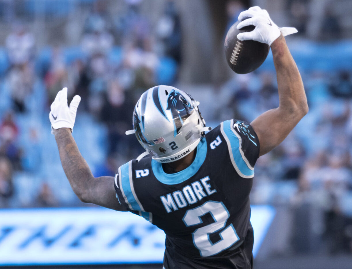 Dec 12, 2021; Charlotte, North Carolina, USA; Carolina Panthers wide receiver D.J. Moore (2) grabs the ball one handed along the sidelines against the Atlanta Falcons during the second half at Bank of America Stadium.