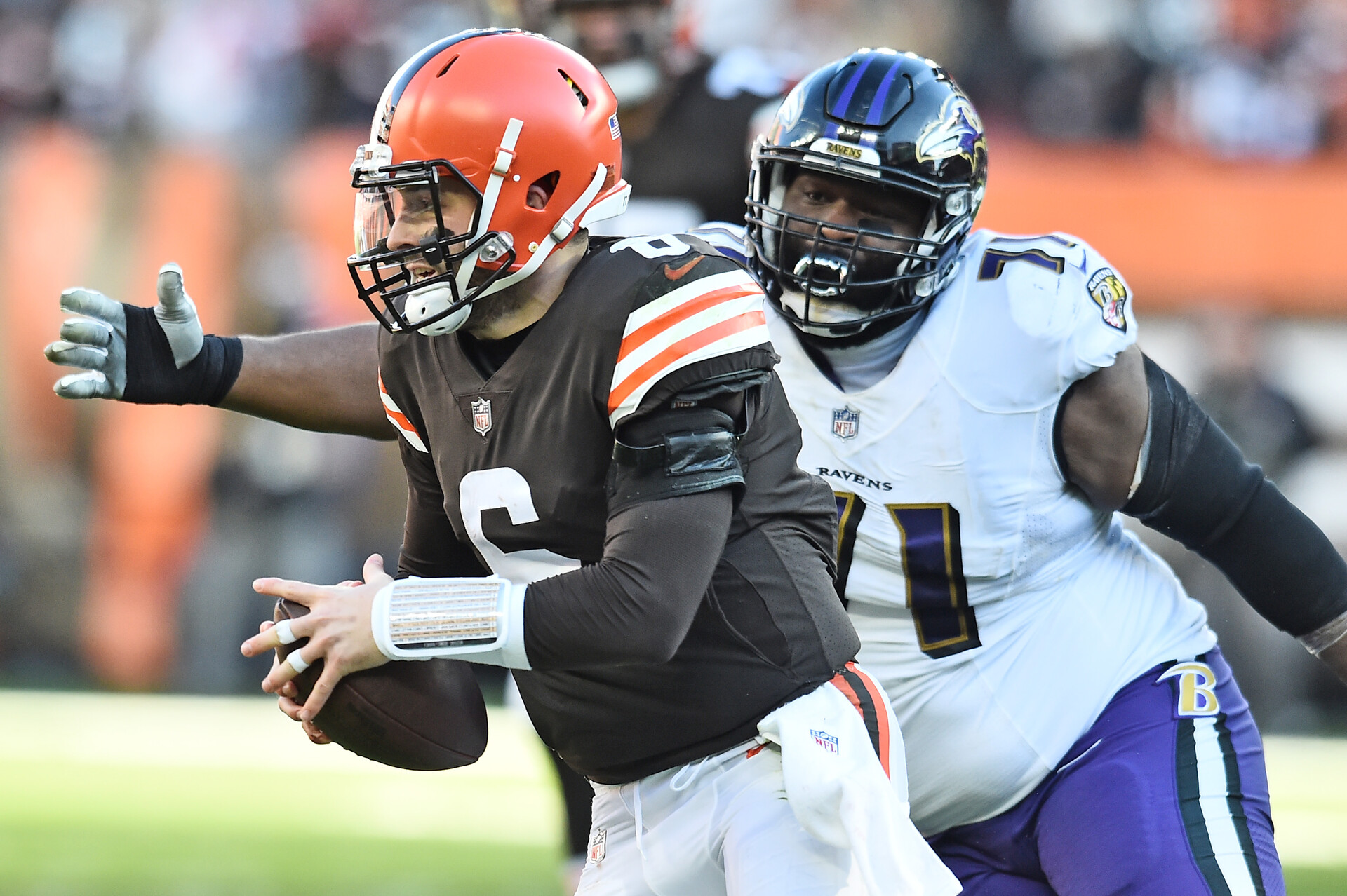 Dec 12, 2021; Cleveland, Ohio, USA; Baltimore Ravens nose tackle Justin Ellis (71) chases Cleveland Browns quarterback Baker Mayfield (6) during the second half at FirstEnergy Stadium.