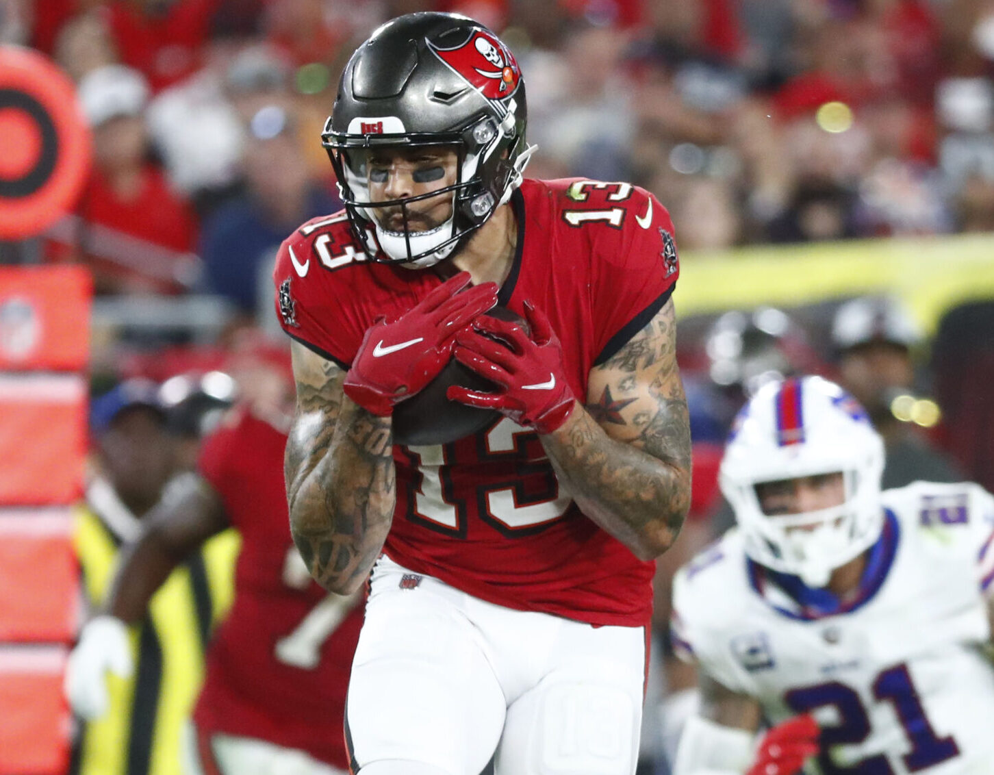 Dec 12, 2021; Tampa, Florida, USA;Tampa Bay Buccaneers wide receiver Mike Evans (13) caches the ball against the Buffalo Bills during the second half at Raymond James Stadium. Mandatory Credit: Kim Klement-USA TODAY Sports