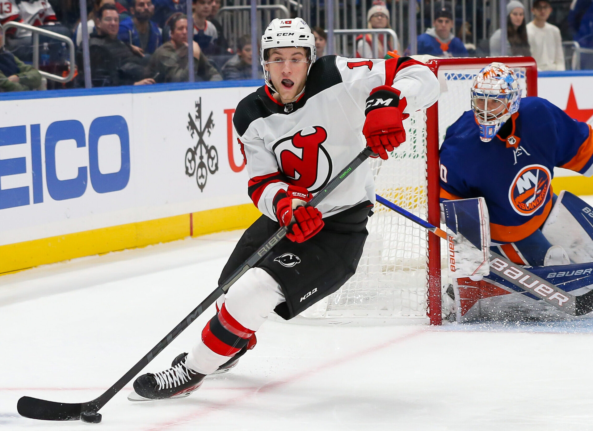 New Jersey Devils center Dawson Mercer skates with the puck against New York Islanders