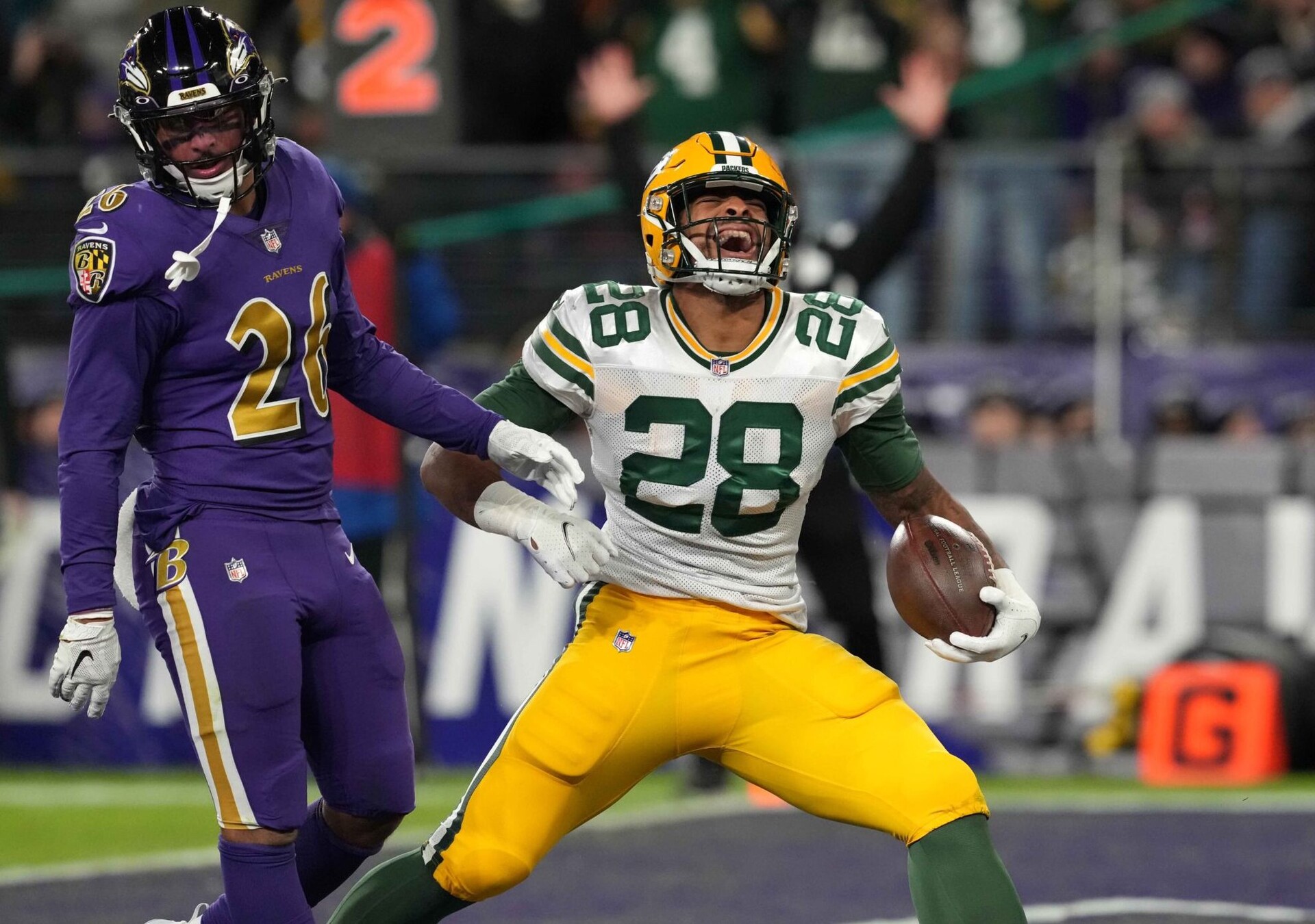 Green Bay Packers running back AJ Dillon reacts after a touchdown run against the Baltimore Ravens