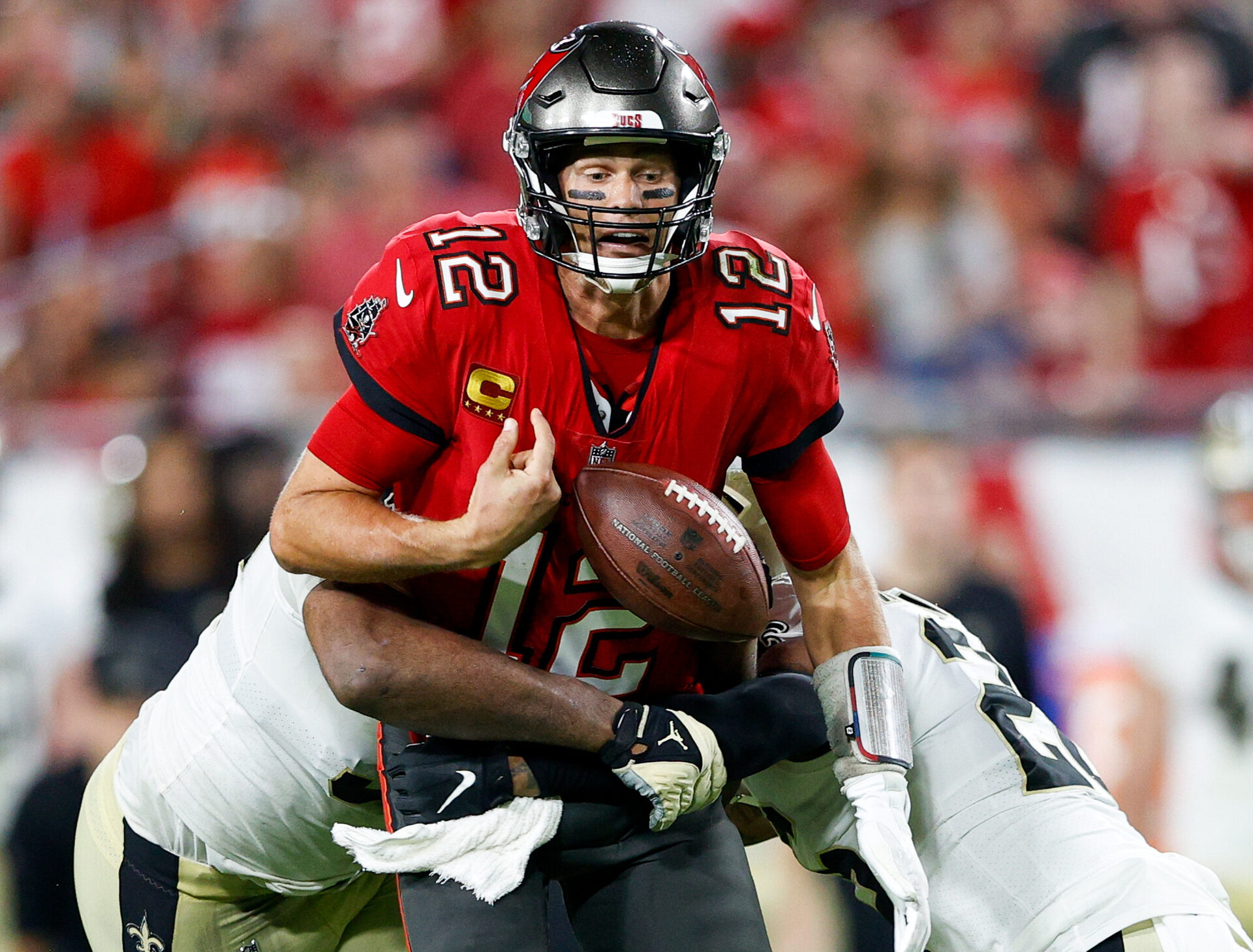 Tampa Bay Buccaneers quarterback Tom Brady fumbles the ball in the second half against the New Orleans Saints