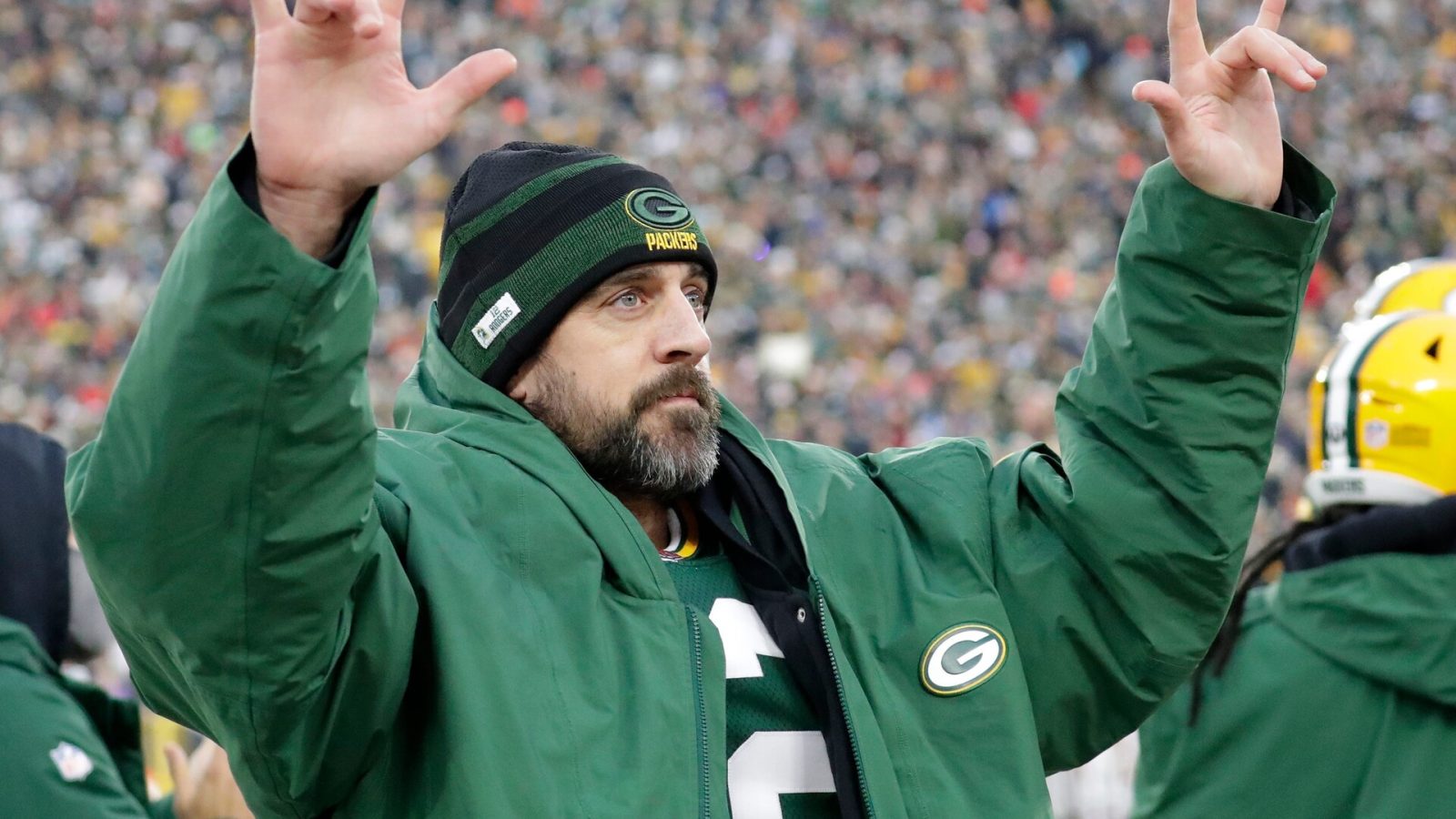 Green Bay Packers quarterback Aaron Rodgers acknowledges the fans after he broke Brett Favre's team record for touchdown passes