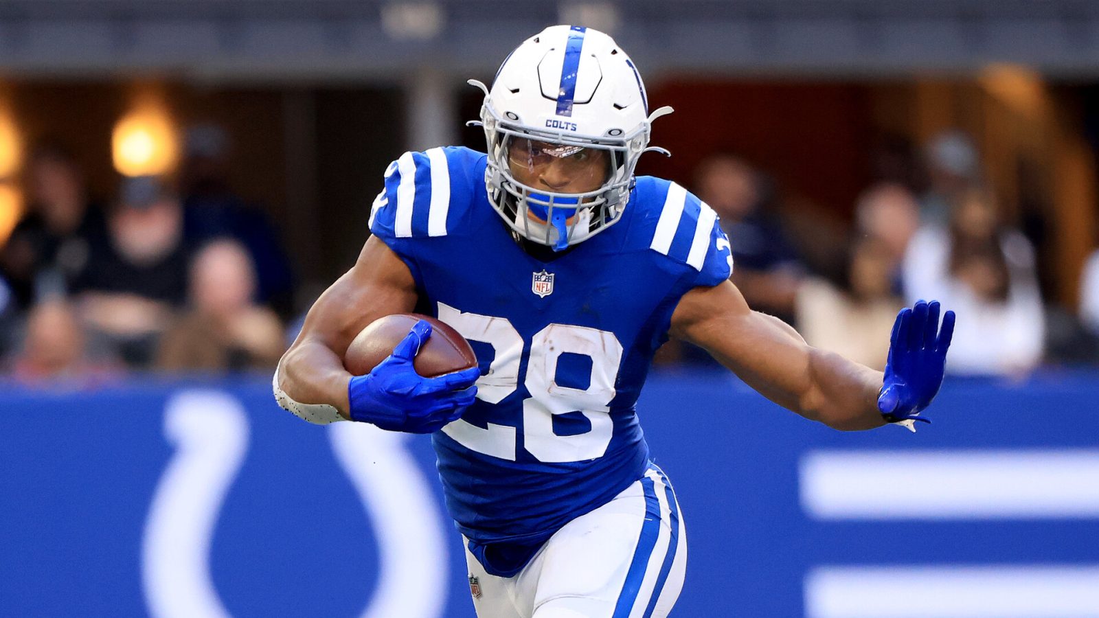 Jonathan Taylor #28 of the Indianapolis Colts runs the ball in the game against the Houston Texans at Lucas Oil Stadium on October 17, 2021 in Indianapolis, Indiana.