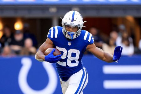 Jonathan Taylor #28 of the Indianapolis Colts runs the ball in the game against the Houston Texans at Lucas Oil Stadium on October 17, 2021 in Indianapolis, Indiana.