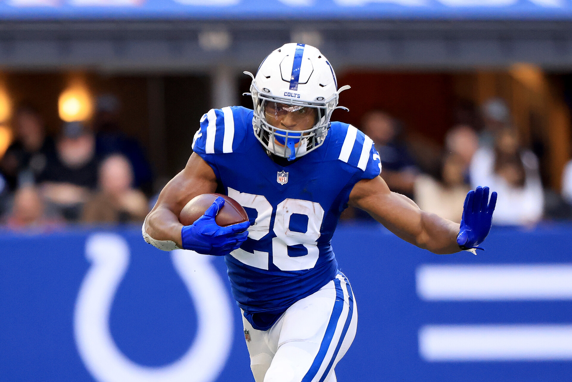 Jonathan Taylor #28 of the Indianapolis Colts runs the ball in the game against the Houston Texans at Lucas Oil Stadium on October 17, 2021 in Indianapolis, Indiana.