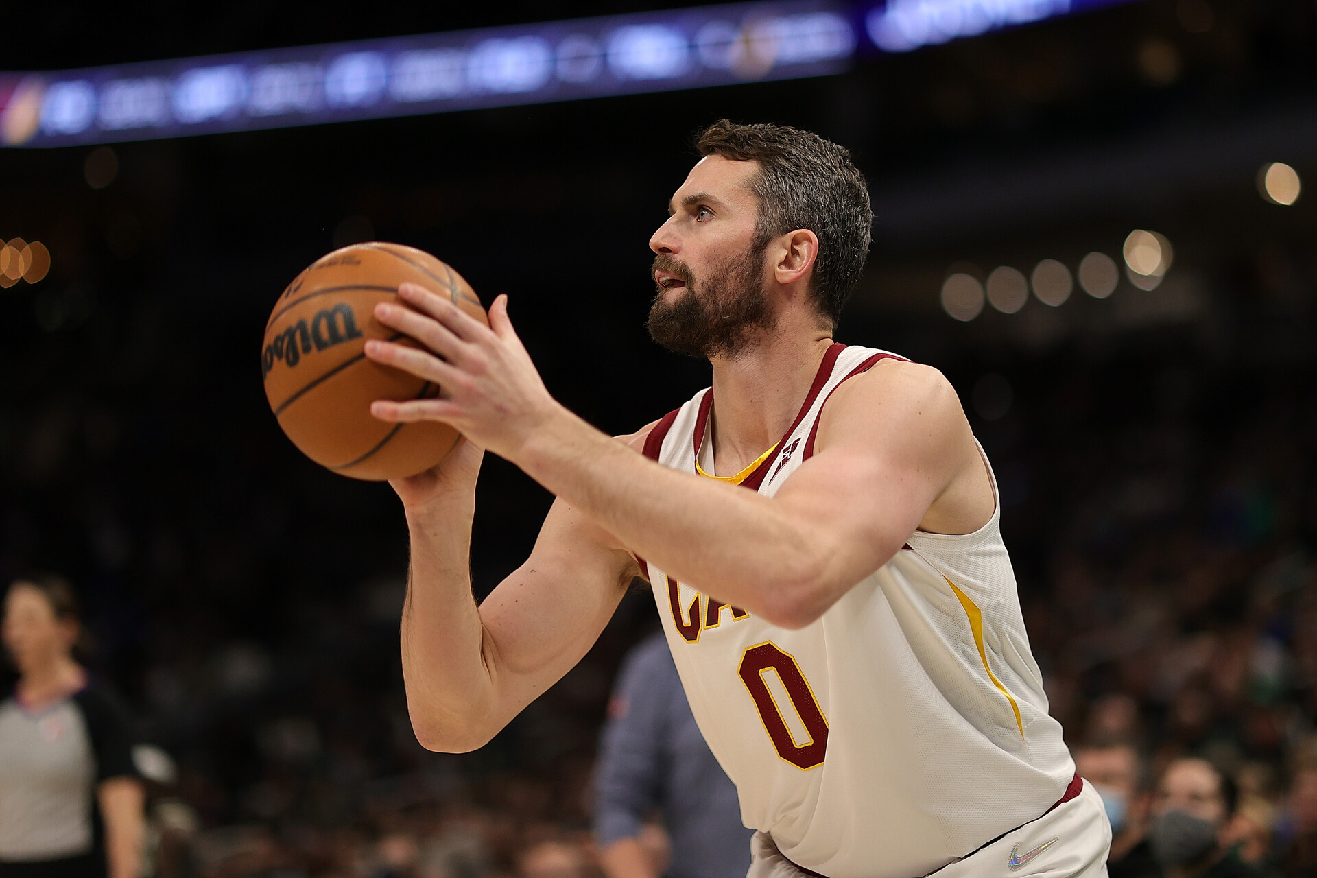 Kevin Love #0 of the Cleveland Cavaliers takes a three point shot during the second half of a game against the Milwaukee Bucks at Fiserv Forum on December 06, 2021 in Milwaukee, Wisconsin.