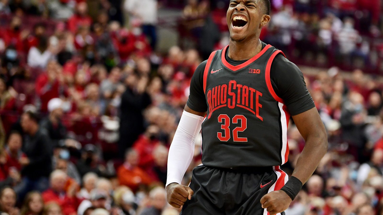 E.J. Liddell #32 of the Ohio State Buckeyes celebrates a basket during the first half of a game against the Wisconsin Badgers at Value City Arena on December 11, 2021 in Columbus, Ohio.
