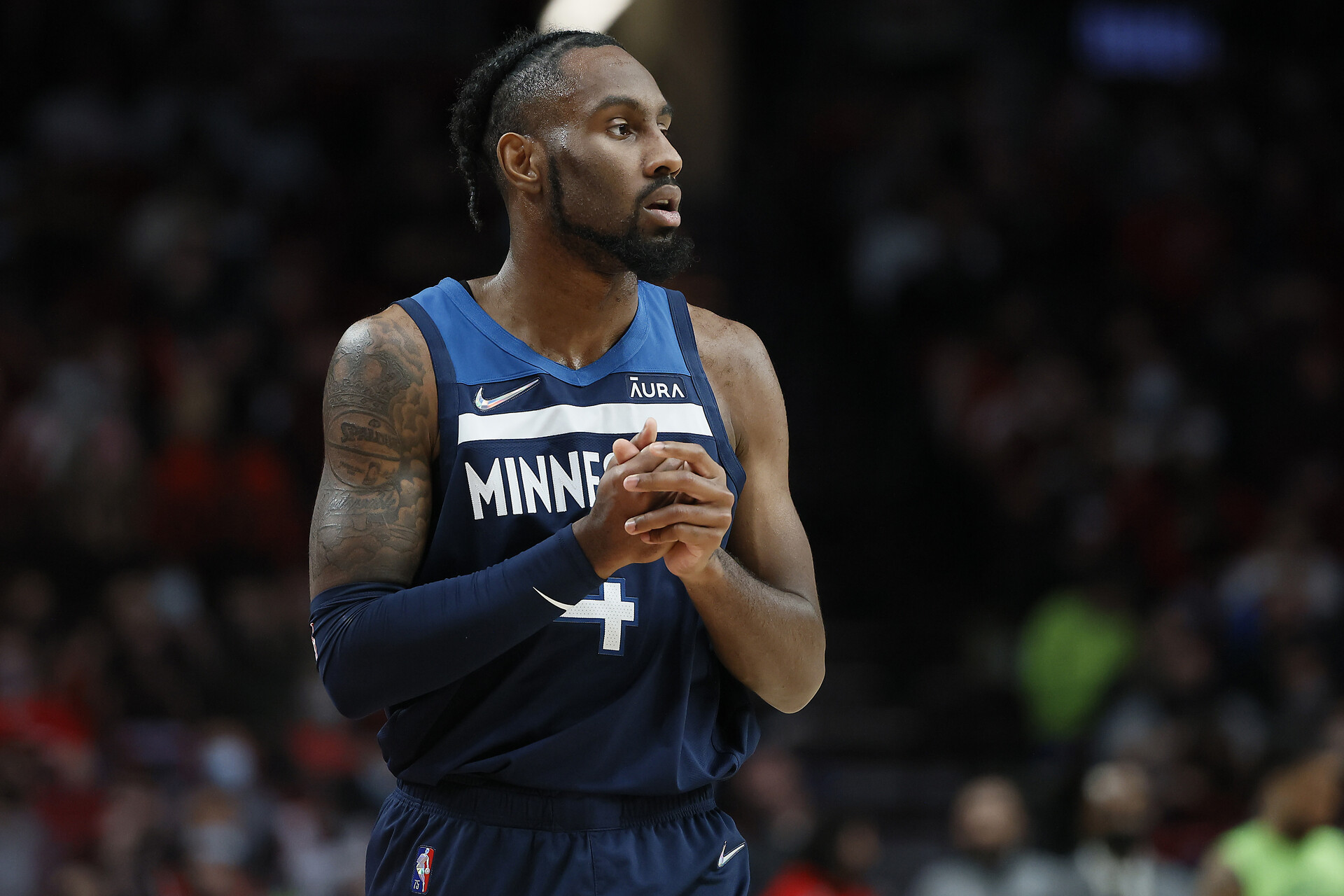 Jaylen Nowell # 4 of the Minnesota Timberwolves looks on during the second half against the Portland Trail Blazers at Moda Center on December 12, 2021 in Portland, Oregon.