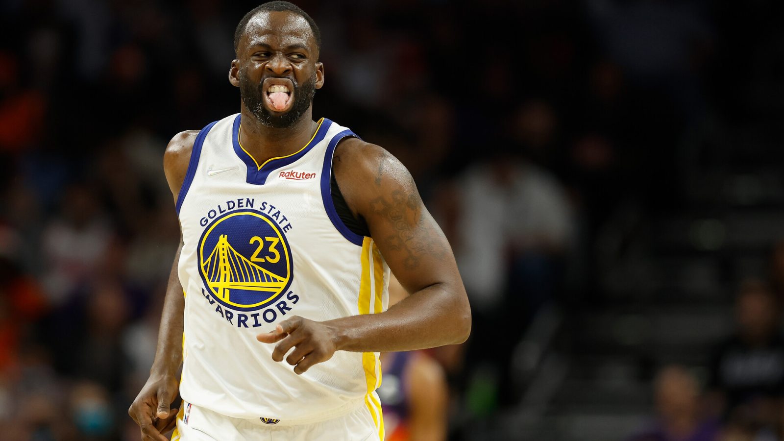 Draymond Green #23 of the Golden State Warriors reacts after a three-point shot against the Phoenix Suns during the second half of NBA game at Footprint Center on December 25, 2021 in Phoenix, Arizona.