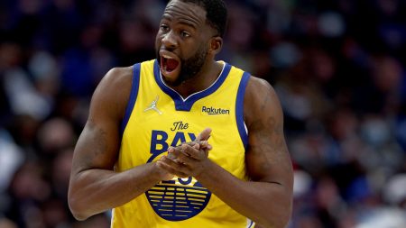 Draymond Green #23 of the Golden State Warriors reacts after being fouled by the Dallas Mavericks in the third quarter at American Airlines Center on January 05, 2022 in Dallas, Texas.