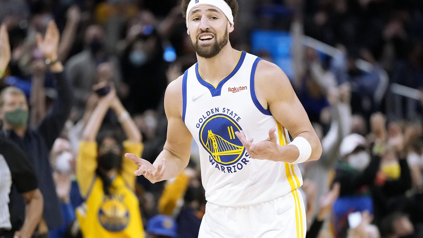Klay Thompson #11 of the Golden State Warriors reacts after scoring on a three-point shot against the Cleveland Cavaliers during the second quarter at Chase Center on January 09, 2022 in San Francisco, California.