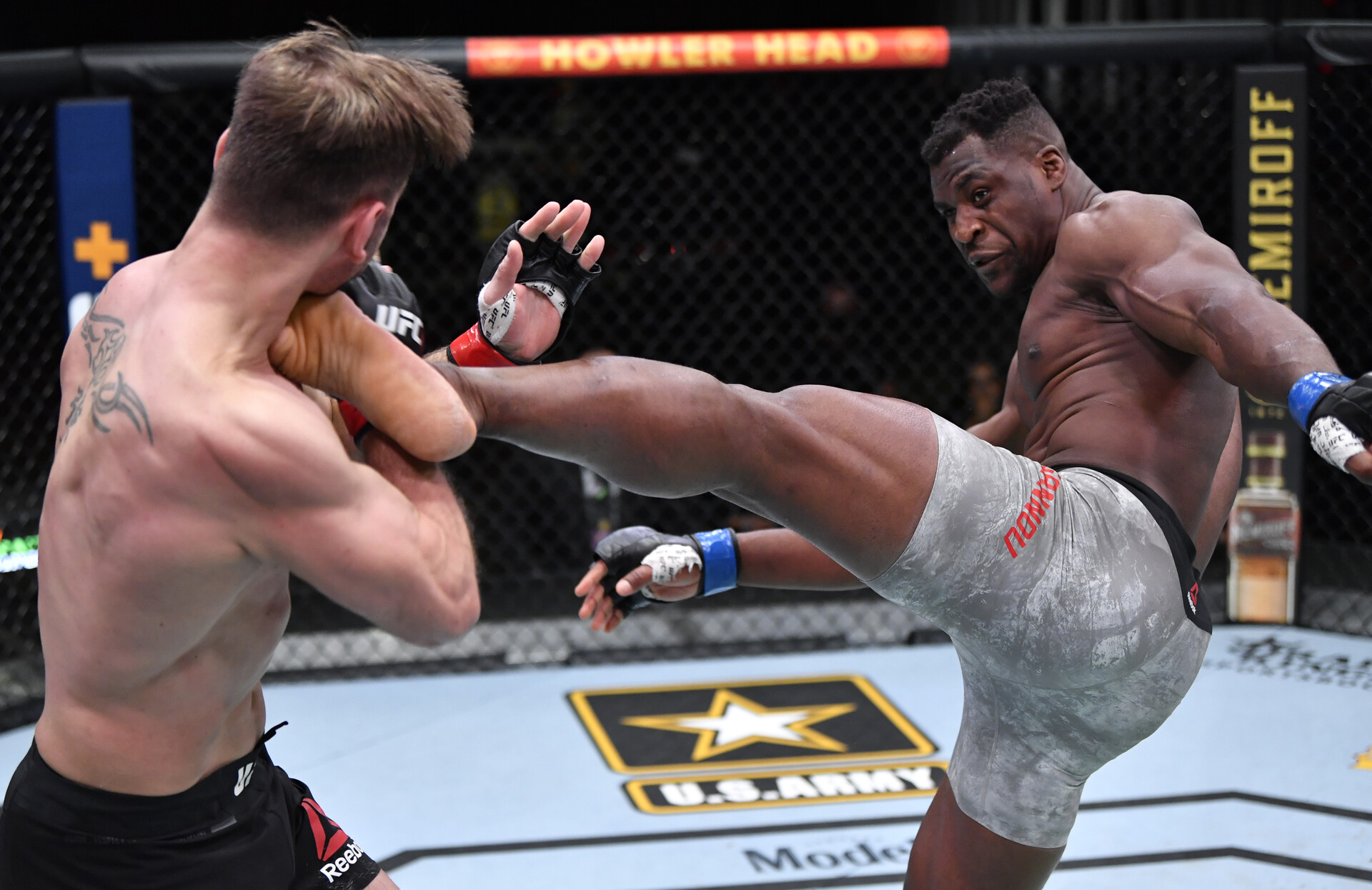 Mar 27, 2021; Las Vegas, NV, USA; Francis Ngannou of Cameroon kicks Stipe Miocic in their UFC heavyweight championship fight during the UFC 260 event at UFC APEX on March 27, 2021 in Las Vegas, Nevada. Mandatory Credit: Jeff Bottari/Handout Photo via USA TODAY Sports