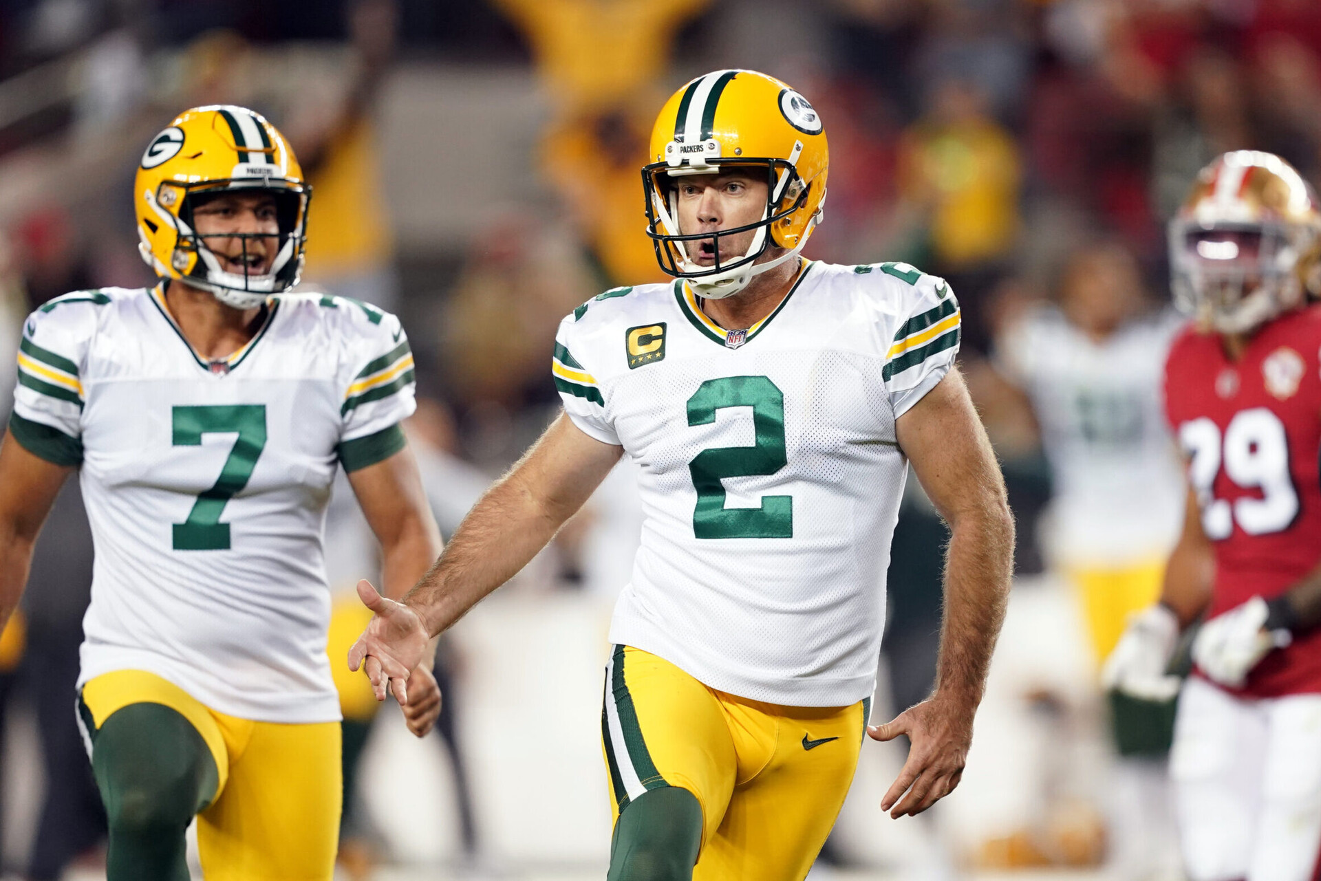 Green Bay Packers kicker Mason Crosby (right) celebrates after kicking a game-winning field goal against the San Francisco 49ers