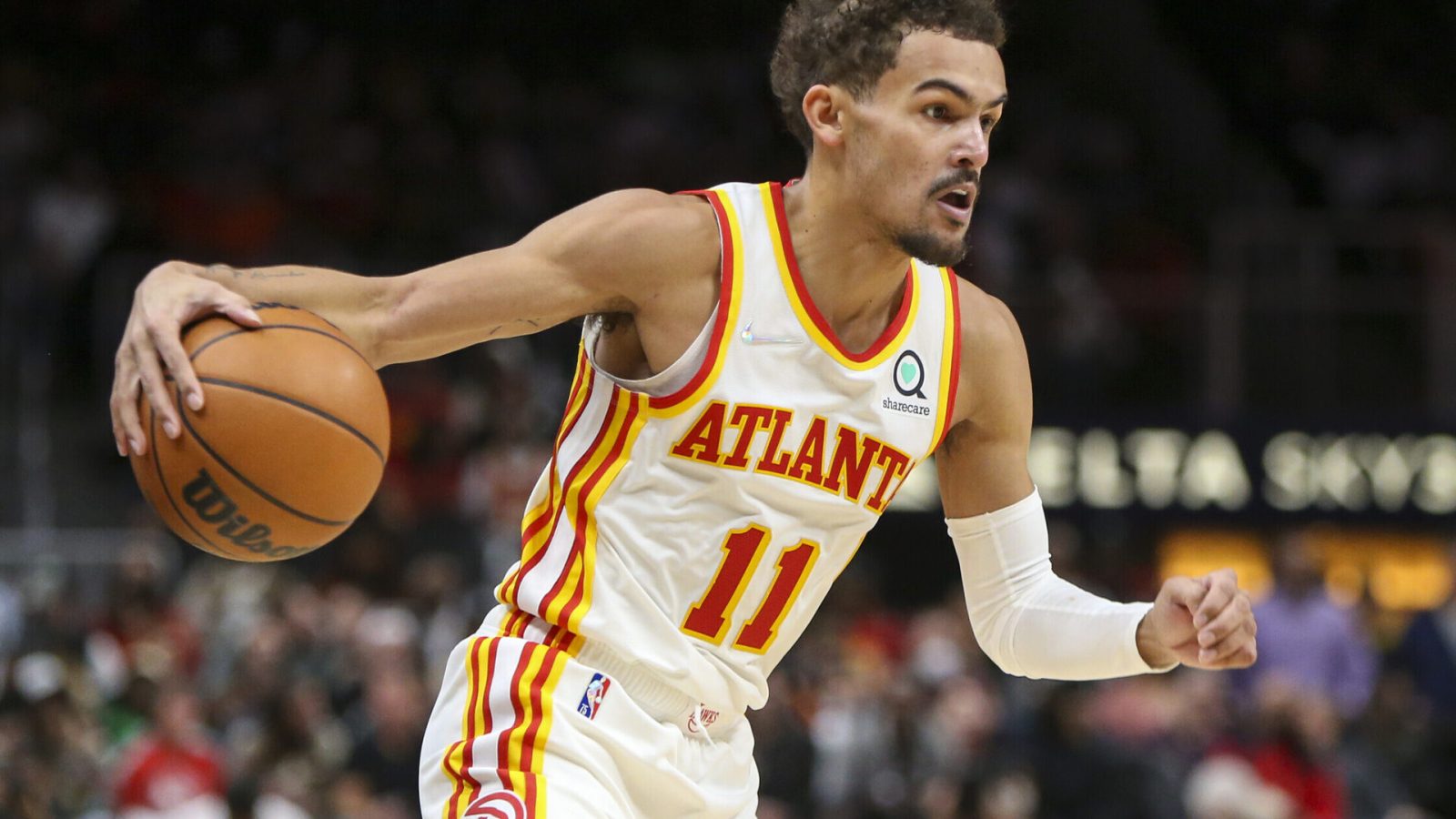 Atlanta Hawks guard Trae Young dribbles the ball during a game against the Denver Nuggets