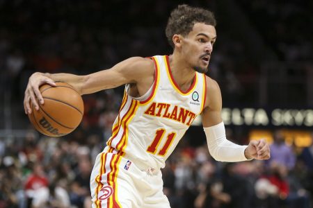 Atlanta Hawks guard Trae Young dribbles the ball during a game against the Denver Nuggets