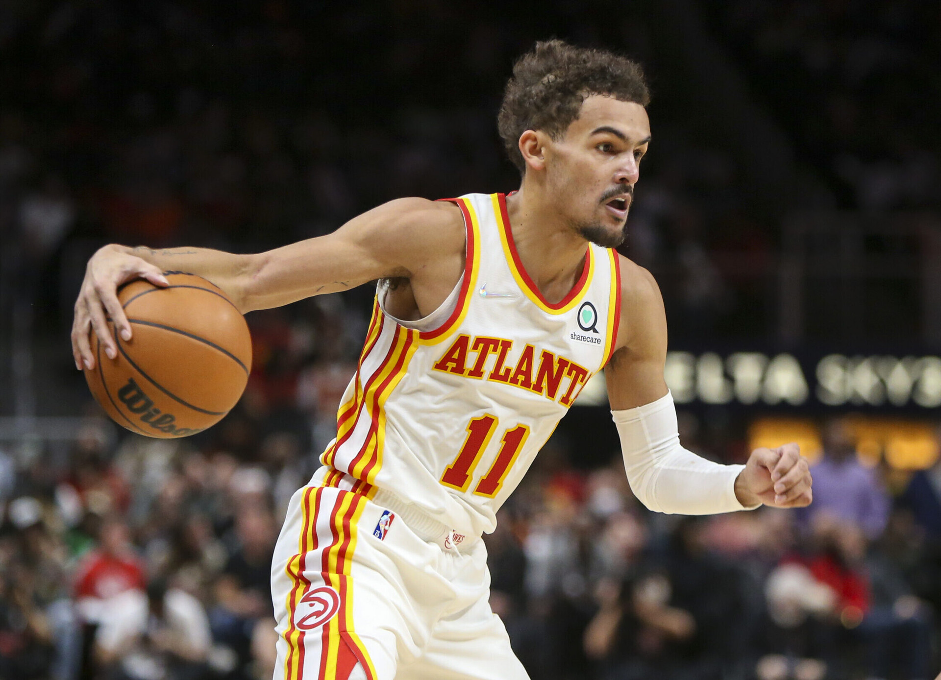 Atlanta Hawks guard Trae Young dribbles the ball during a game against the Denver Nuggets