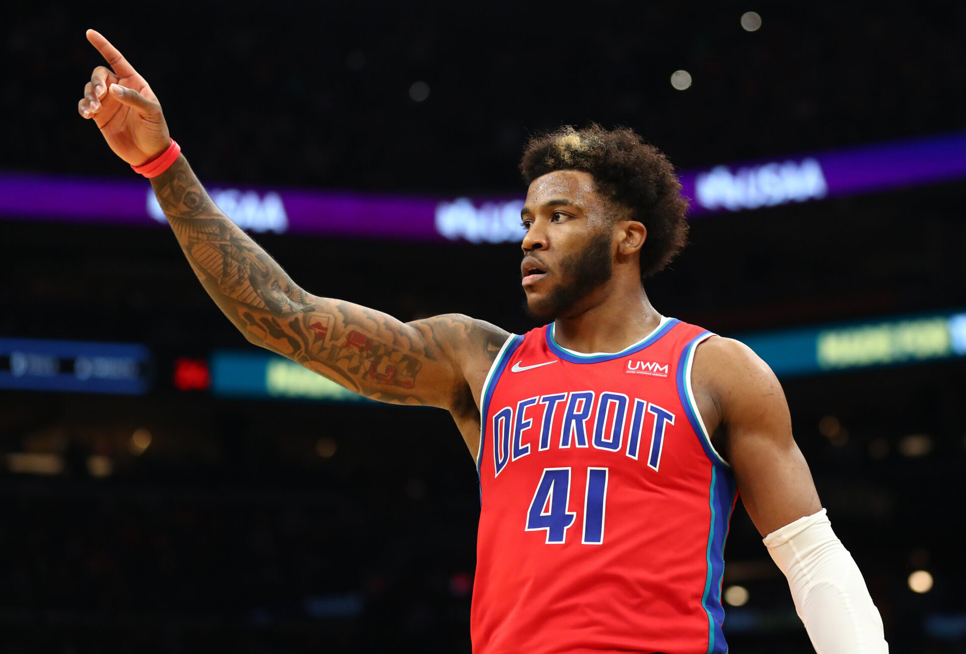 Detroit Pistons forward Saddiq Bey gestures to an unseen teammate with his right hand during a game against the Phoenix Suns