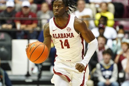 Alabama Crimson Tide guard Keon Ellis brings the basketball down court against Tennessee Volunteers