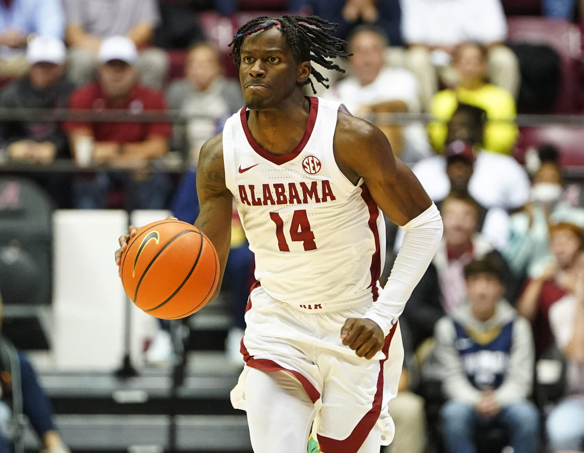 Alabama Crimson Tide guard Keon Ellis brings the basketball down court against Tennessee Volunteers
