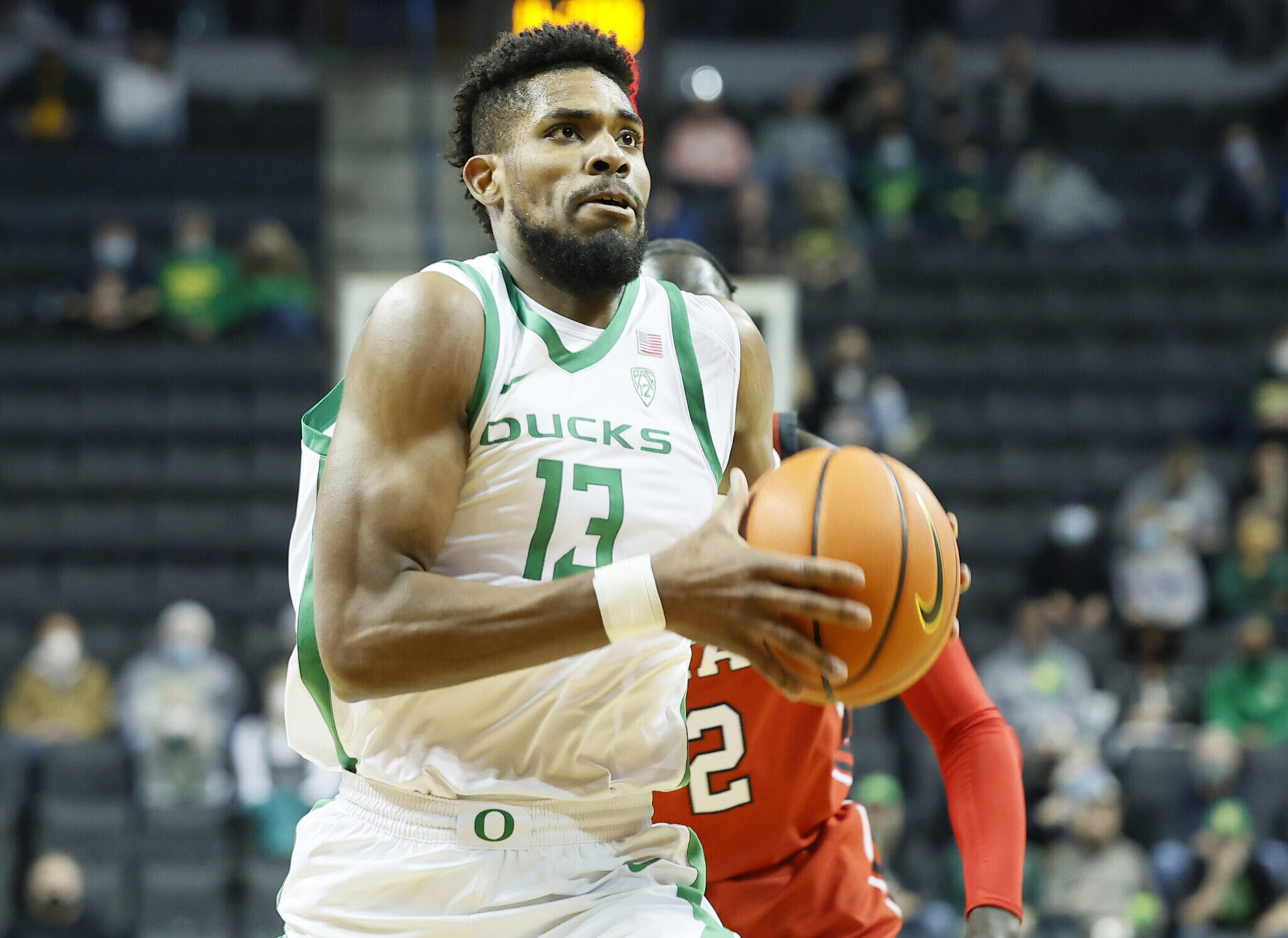 Oregon Ducks forward Quincy Guerrier drives to the basket in a Pac-12 game against the Utah Utes