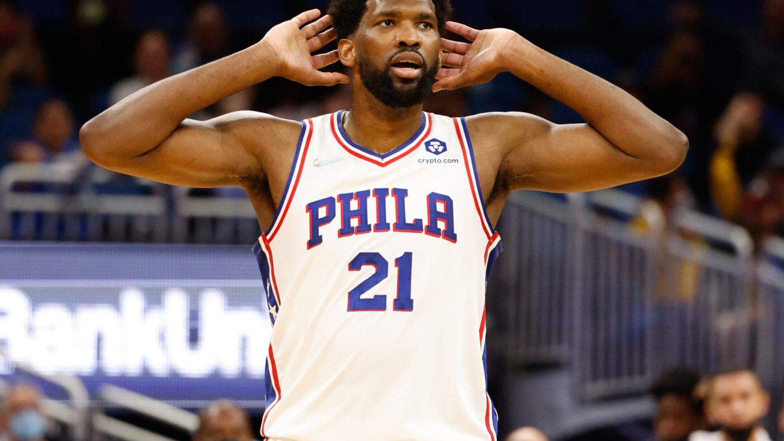 Philadelphia 76ers center Joel Embiid reacts to chants of MVP from the crowd during a game against the Orlando Magic