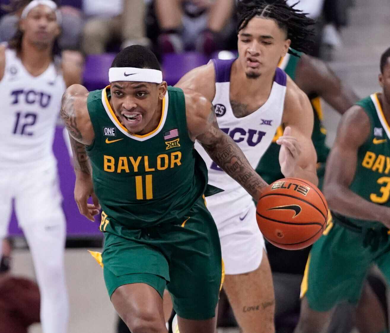 Baylor Bears guard James Akinjo dribbles the ball up court against the TCU Horned Frogs during a Big 12 basketball game