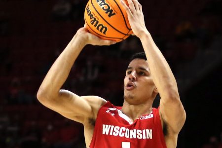 Wisconsin Badgers guard Johnny Davis takes a shot against the Maryland Terrapins during the first half of a Big Ten basketball game.