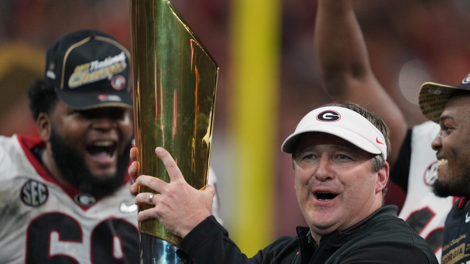 Jan 10, 2022; Indianapolis, IN, USA; Georgia Bulldogs head coach Kirby Smart holds the National Championship trophy after defeating the Alabama Crimson Tide in the 2022 CFP college football national championship game at Lucas Oil Stadium. Mandatory Credit: Kirby Lee-USA TODAY Sports