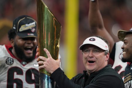 Jan 10, 2022; Indianapolis, IN, USA; Georgia Bulldogs head coach Kirby Smart holds the National Championship trophy after defeating the Alabama Crimson Tide in the 2022 CFP college football national championship game at Lucas Oil Stadium. Mandatory Credit: Kirby Lee-USA TODAY Sports