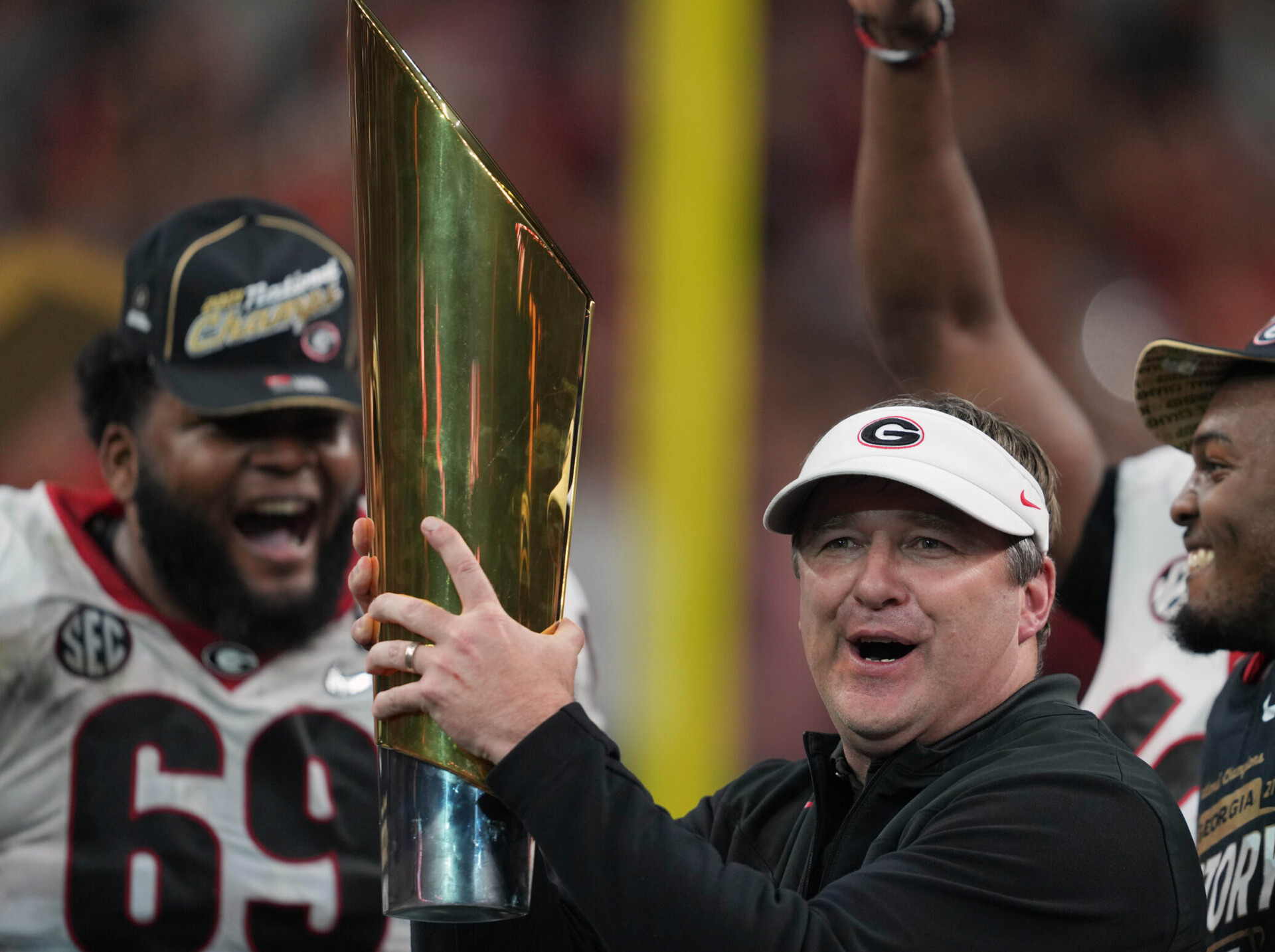 Jan 10, 2022; Indianapolis, IN, USA; Georgia Bulldogs head coach Kirby Smart holds the National Championship trophy after defeating the Alabama Crimson Tide in the 2022 CFP college football national championship game at Lucas Oil Stadium. Mandatory Credit: Kirby Lee-USA TODAY Sports