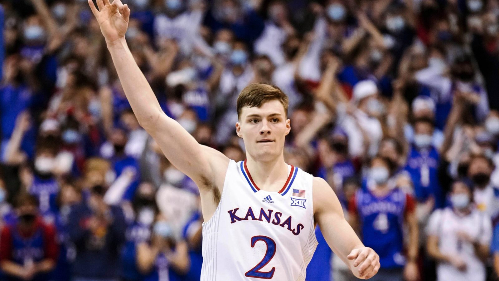 Kansas Jayhawks guard Christian Braun celebrates after making a 3-point basketball against the Iowa State Cyclones during a Big 12 basketball game