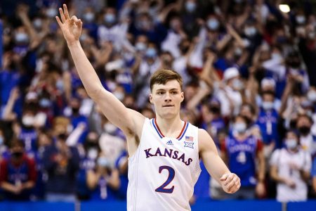 Kansas Jayhawks guard Christian Braun celebrates after making a 3-point basketball against the Iowa State Cyclones during a Big 12 basketball game