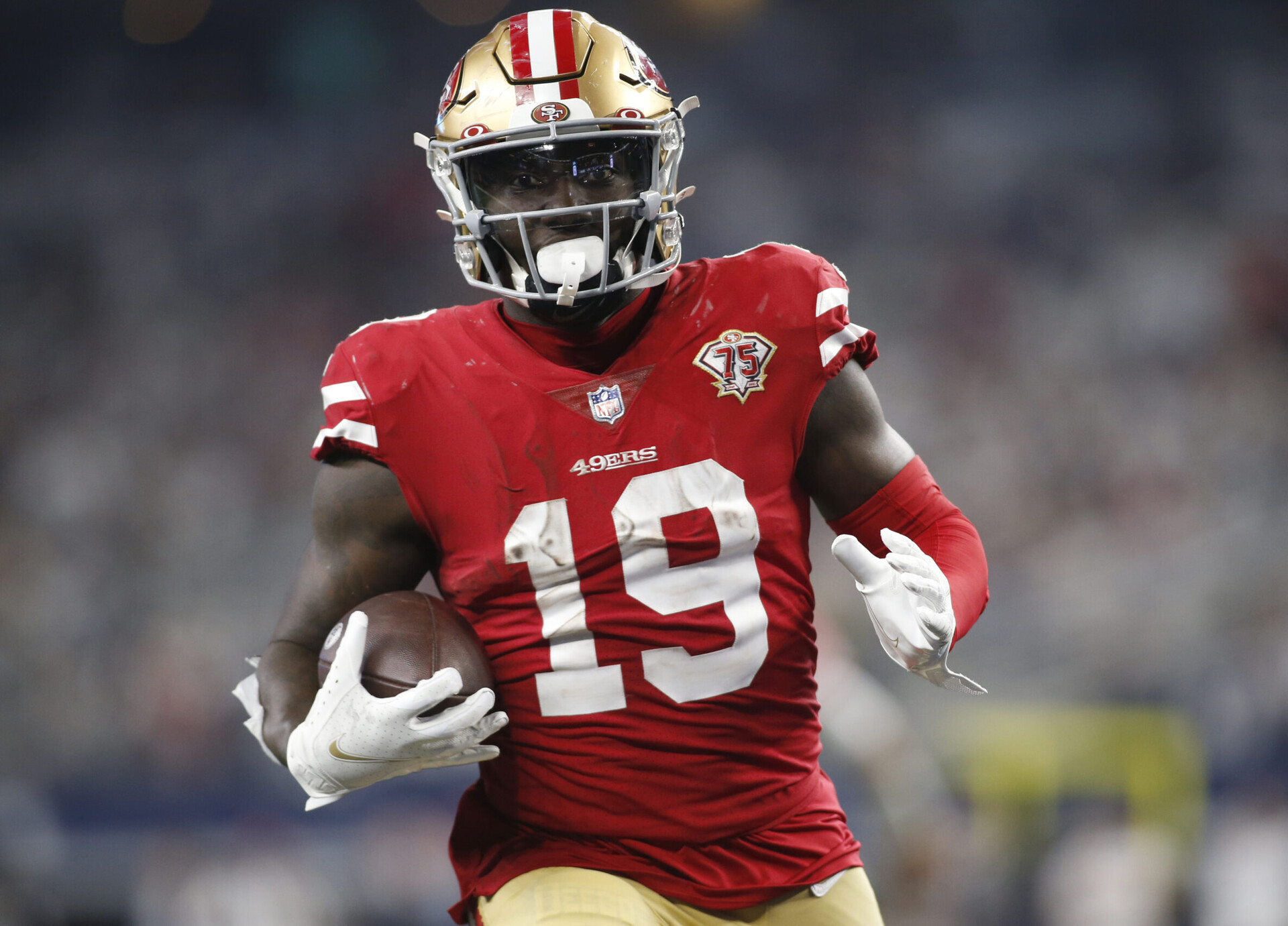 San Francisco 49ers wide receiver Deebo Samuel runs for a touchdown after catching a pass against the Dallas Cowboys in a NFC Wild Card playoff football game
