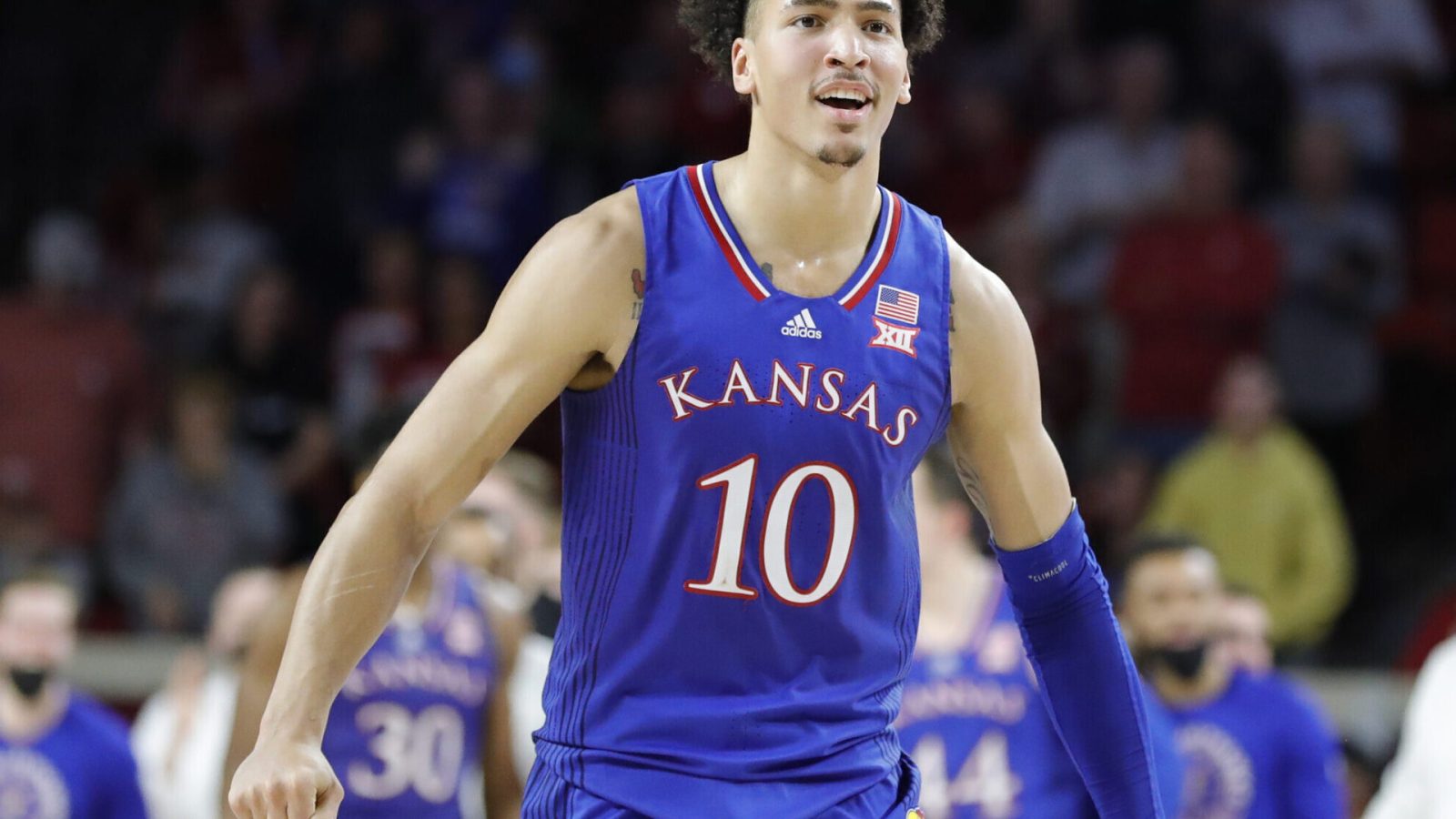 Kansas Jayhawks forward Jalen Wilson reacts after his team scores against the Oklahoma Sooners during a Big 12 basketball game.