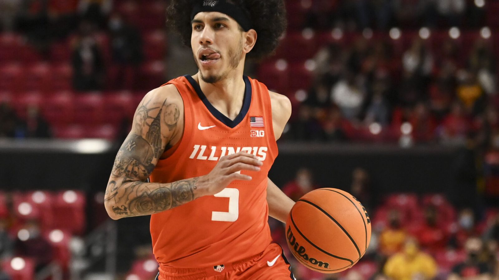 Illinois Fighting Illini guard Andre Curbelo dribbles during a Big Ten basketball game against the Maryland Terrapins
