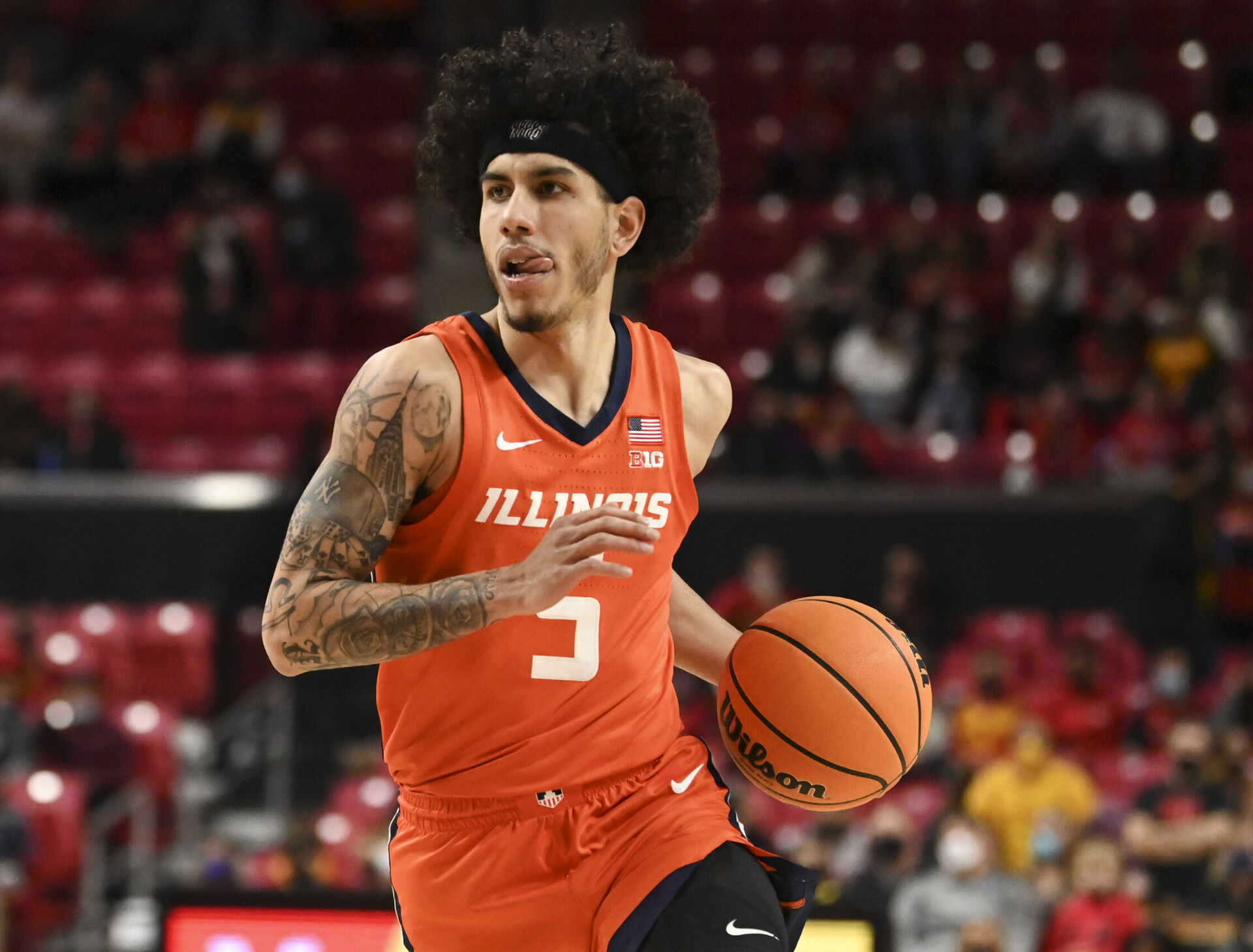 Illinois Fighting Illini guard Andre Curbelo dribbles during a Big Ten basketball game against the Maryland Terrapins