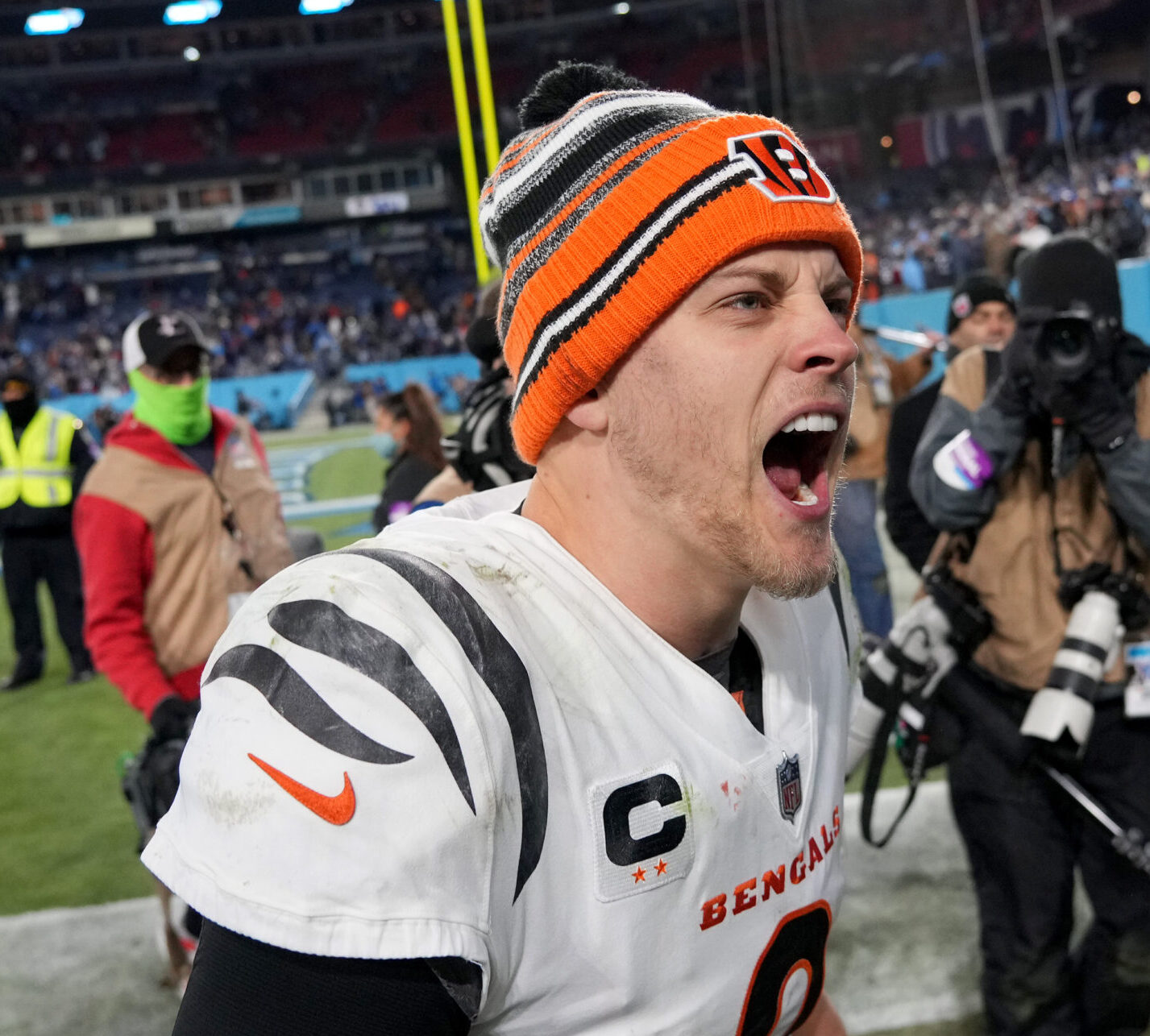 Jan 22, 2022; Nashville, Tennessee, USA; Cincinnati Bengals quarterback Joe Burrow (9) celebrates after defeating the Tennessee Titans 19-16 during the AFC Divisional playoff football game at Nissan Stadium. Mandatory Credit: Kirby Lee-USA TODAY Sports