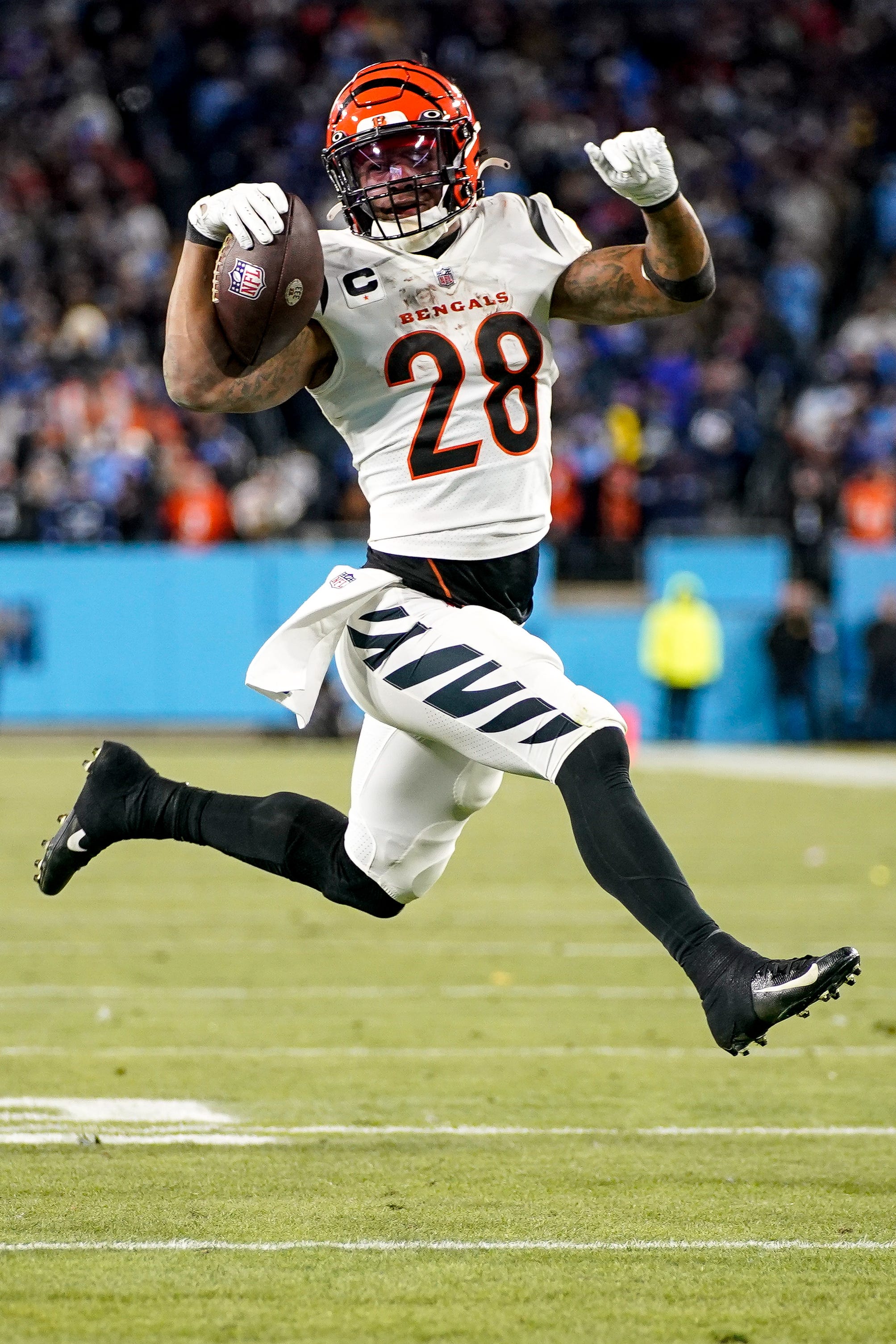 Cincinnati Bengals running back Joe Mixon (28) runs in a touchdown during the third quarter of an AFC Divisional playoff game against the Tennessee Titans at Nissan Stadium Saturday, Jan. 22, 2022 in Nashville, Tenn. Titans Bengals 012222 An 006