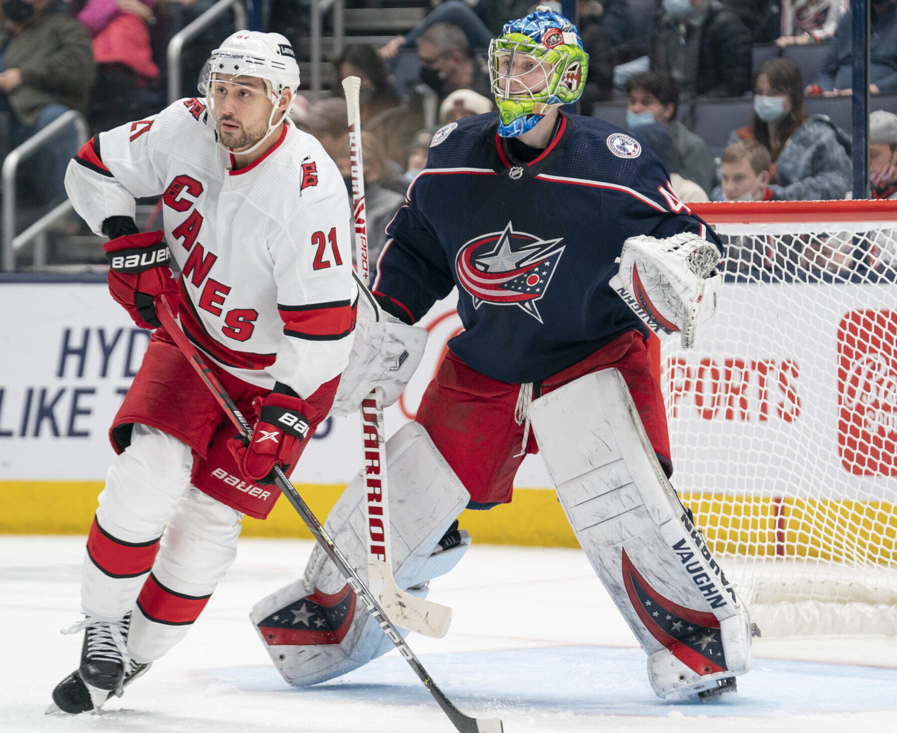 Carolina Hurricanes right wing Nino Niederreiter (left) skates in front of Columbus Blue Jackets goaltender Daniil Tarasov (right)