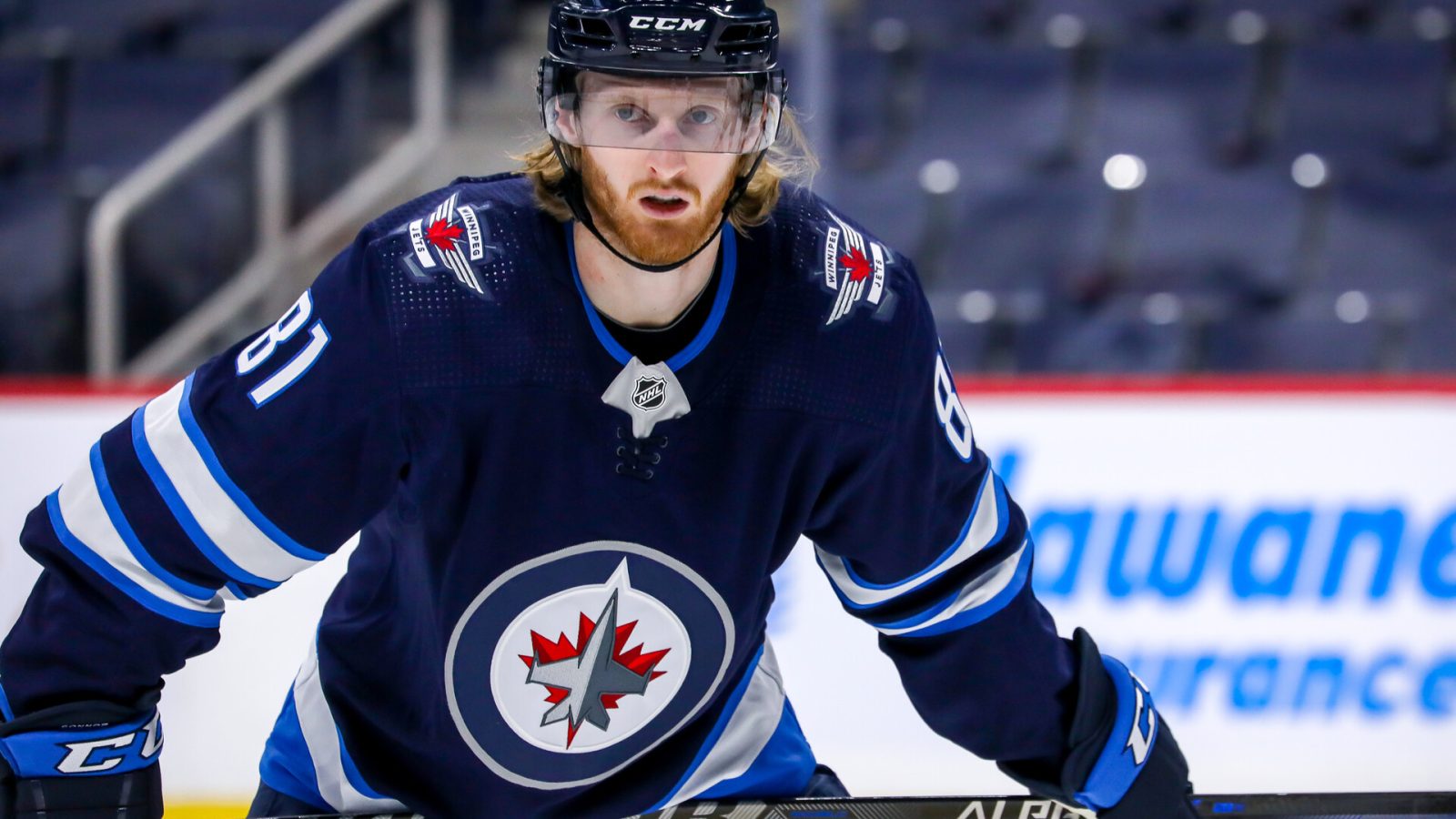 Kyle Connor #81 of the Winnipeg Jets prepares for a third period face-off against the Florida Panthers at Canada Life Centre on January 25, 2022 in Winnipeg, Manitoba, Canada.