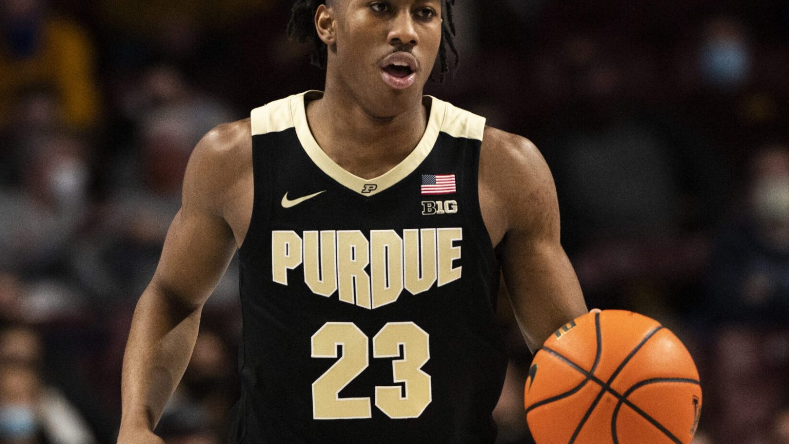 Purdue Boilermakers guard Jaden Ivey brings the ball up the court in a Big Ten basketball game against the Minnesota Golden Gophers